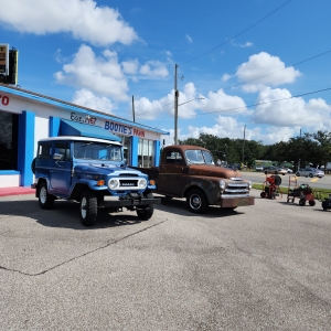 Old Toyota Land Cruiser and Old Dodge Pickup Truck at Bootie's Pawn Shop