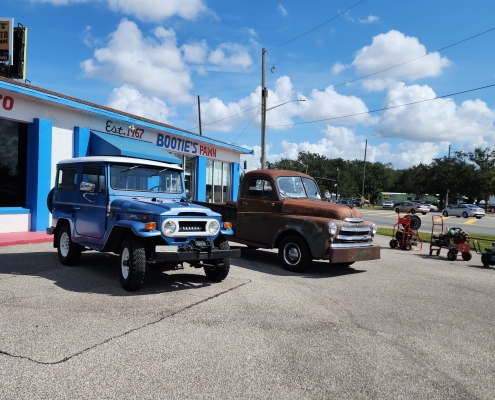 Old Toyota Land Cruiser and Old Dodge Pickup Truck at Bootie's Pawn Shop